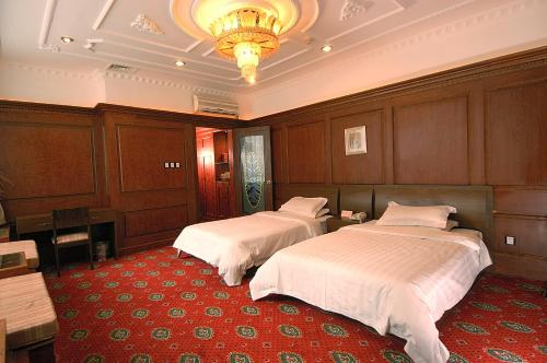 
A bed or beds in a room at Shangfu Jiari Hotel Nanjing Pedestrian Street
