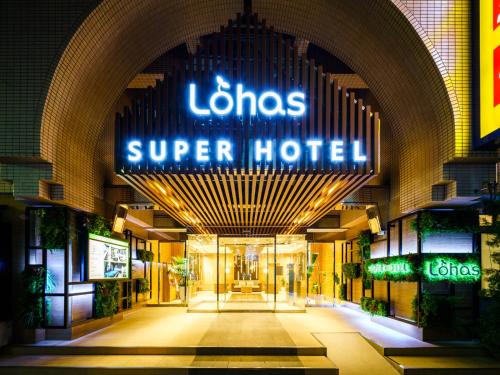 a building with a sign that reads lolis super hotel at Super Hotel Ikebukuro-Eki Kitaguchi in Tokyo