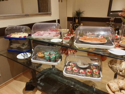 a buffet table filled with lots of different types of pastries at Erlanger Hof in Berlin