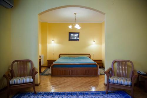 Giường trong phòng chung tại Hotel Obolon