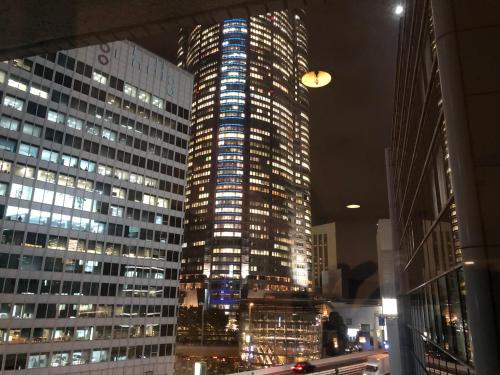 a tall building in a city at night at Roppongi Plaza Hotel in Tokyo