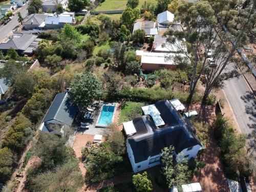 an aerial view of a house with a swimming pool at Mountain View Swellendam in Swellendam