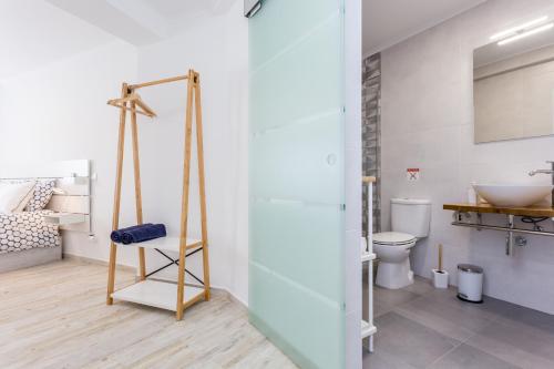 a bathroom with a toilet and a sink at Sleep Inn Lagos - Rooms in Lagos