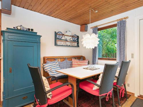 a dining room with a table and chairs at 4 person holiday home in Gedser in Gedser