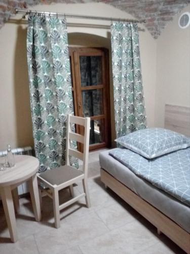 Ένα ή περισσότερα κρεβάτια σε δωμάτιο στο Rynek 7 - Apartamenty