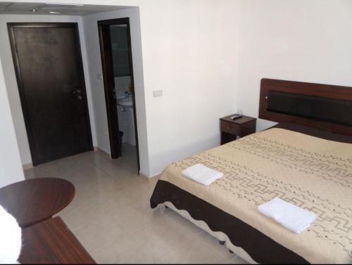 Postel nebo postele na pokoji v ubytování Alexander Hotel