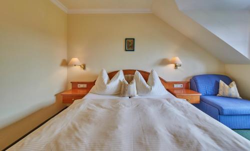 Ein Bett oder Betten in einem Zimmer der Unterkunft Hotel Die Pflegerbrücke