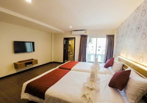 Katil atau katil-katil dalam bilik di Tee Pak Dee Resident Phuket