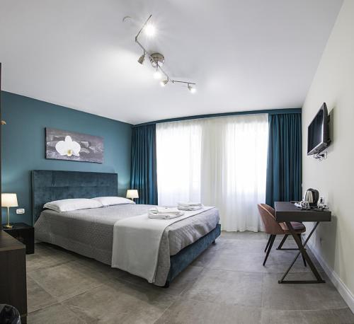 Postel nebo postele na pokoji v ubytování Regolo Rooms Vaticano