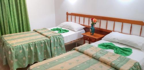 Ένα ή περισσότερα κρεβάτια σε δωμάτιο στο Apartamentos Isabel