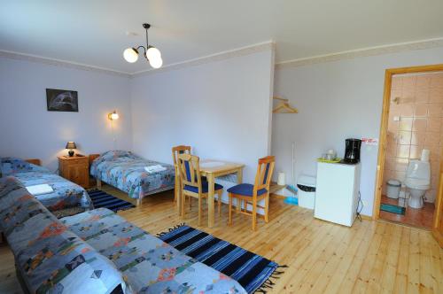 a living room with a couch and a table at Villa Ene in Pärnu