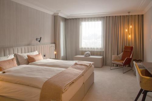 Un ou plusieurs lits dans un hébergement de l'établissement Kongress Hotel Davos