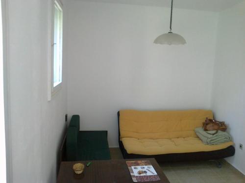a living room with a couch and a table at Burgas Urban Studio -Budjet Studio in Burgas