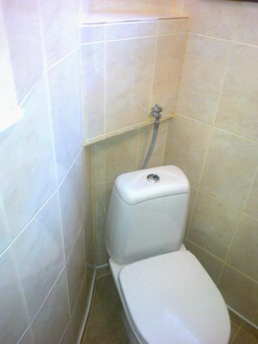 a bathroom with a white toilet in a room at Burgas Urban Studio -Budjet Studio in Burgas
