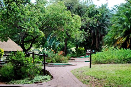 a sign that says walk out in a park at Kruger Park Lodge Unit No. 608A in Hazyview