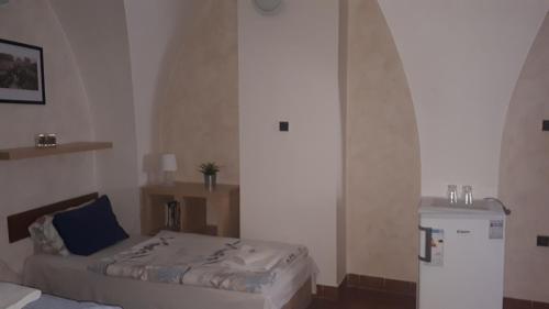 
Postel nebo postele na pokoji v ubytování Penzion a restaurace Modrá růže Tábor

