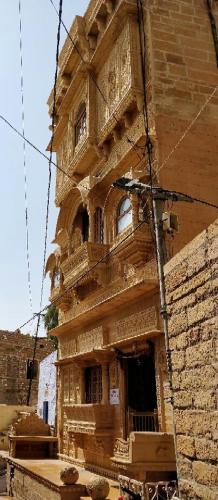 an old brick building with an open door at Fort Villa in Jaisalmer