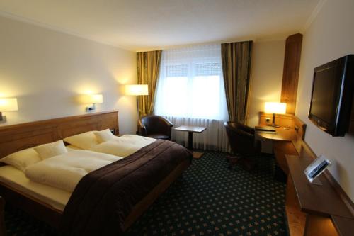Postel nebo postele na pokoji v ubytování Eden-Hotel