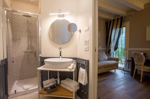 a bathroom with a sink and a shower at Villa Pergola by Palazzo di Varignana in Varignana