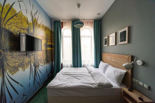 Ένα ή περισσότερα κρεβάτια σε δωμάτιο στο Vesna Hotel