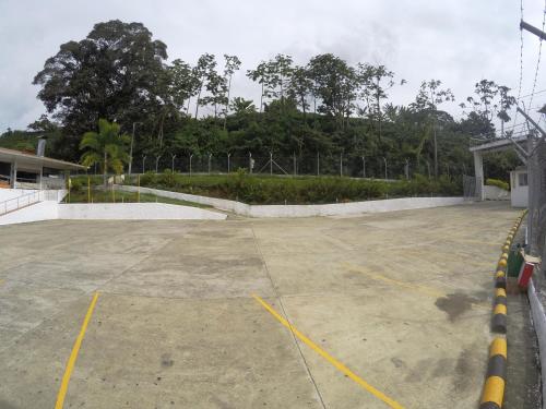 a parking lot with yellow lines on the ground at Sky Club Eco Hotel in Belén de Umbría