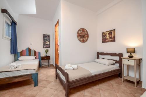 Ένα ή περισσότερα κρεβάτια σε δωμάτιο στο Theonis Villas