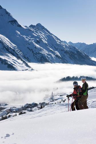 two people standing on top of a snow covered mountain at Haus König in Bezau