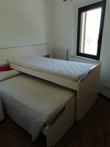 Postel nebo postele na pokoji v ubytování APARTMENT LA FONTE