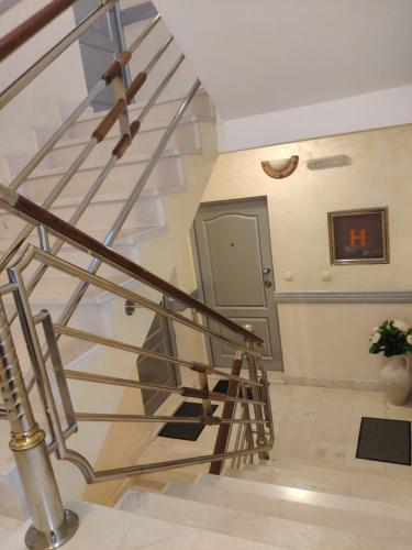 a metal spiral staircase in a building with a door at Apartments Stević - Monaco in Budva