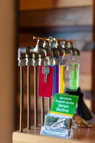 a group of keys hanging on a metal rack at Acquarello in Lapedona