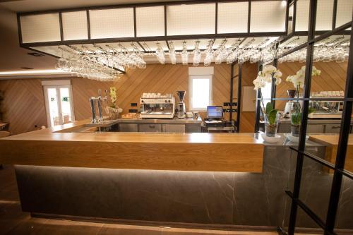 a bar in a kitchen with a counter top at Hotel Diufain in Conil de la Frontera