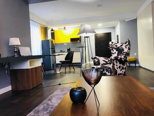 a living room with a wine glass on a table at VNVP Apartment in Štip