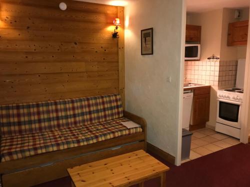 a small room with a bench in a kitchen at The Ski Paradise 2 Alpes in Les Deux Alpes