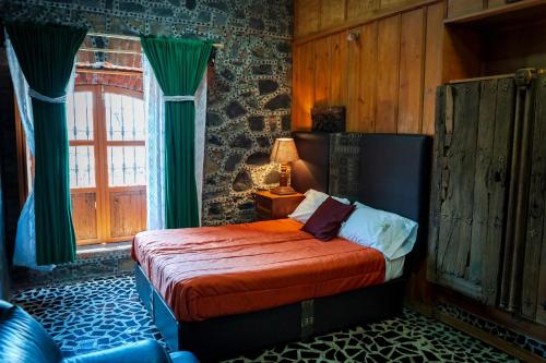 Un pat sau paturi într-o cameră la Hotel Vitorina