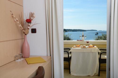 a table that has a table cloth on it at Boutique Hotel Mauro in Poreč