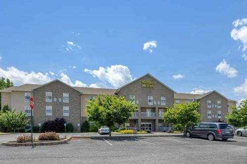 a rendering of a hotel with a parking lot at MainStay Suites Grantville - Hershey North in Grantville
