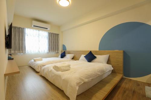 Postel nebo postele na pokoji v ubytování Colorful Balloons Homestay