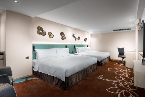 Postel nebo postele na pokoji v ubytování K Hotel Taipei II