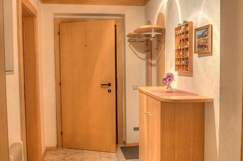 a hallway with a wooden door in a room at Haus am Römerbad in Bad Kleinkirchheim