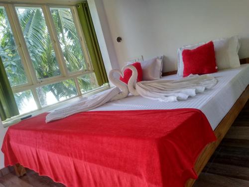 Ένα ή περισσότερα κρεβάτια σε δωμάτιο στο Blue Birds Homestay