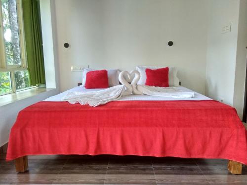 Ένα ή περισσότερα κρεβάτια σε δωμάτιο στο Blue Birds Homestay