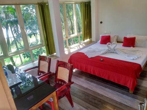 Ένα ή περισσότερα κρεβάτια σε δωμάτιο στο Blue Birds Homestay