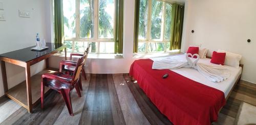 Ένα ή περισσότερα κρεβάτια σε δωμάτιο στο Blue Birds Homestay