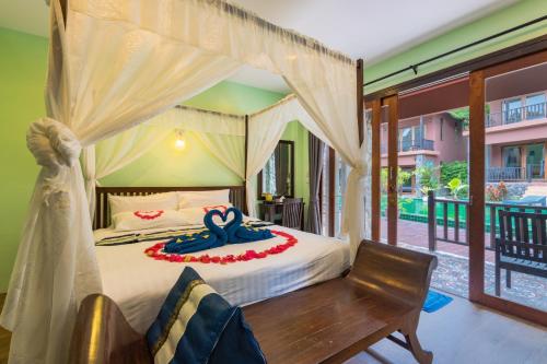 Ένα ή περισσότερα κρεβάτια σε δωμάτιο στο Koh Tao Beach Club