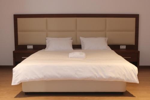 מיטה או מיטות בחדר ב-Union Hotel Grozny