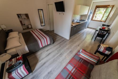 an aerial view of a bedroom with a bed and a kitchen at Home in Orvieto - Via dei Dolci in Orvieto
