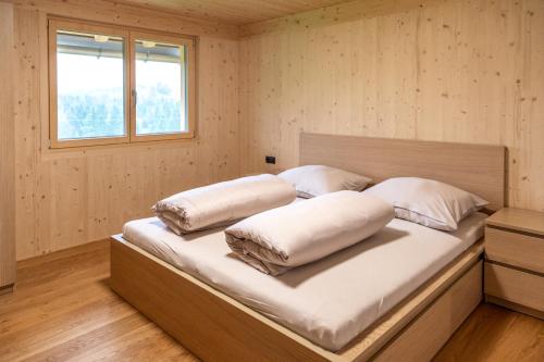 Postel nebo postele na pokoji v ubytování Hus Bündt