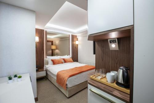 Postel nebo postele na pokoji v ubytování Sherry Suites Karaköy