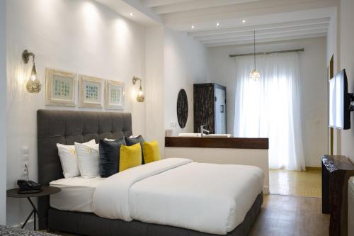 Ein Bett oder Betten in einem Zimmer der Unterkunft Suite Azur Hotel