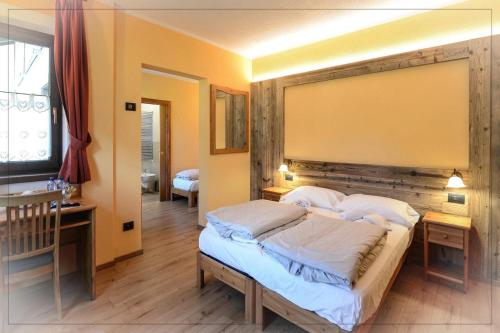 Ένα ή περισσότερα κρεβάτια σε δωμάτιο στο Agriturismo La Poina
